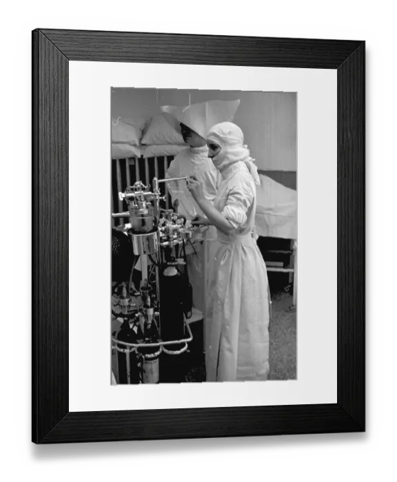 Framed Print : More Gas. 1st October 1938: A nurse regulates the flow of anaesthetic during