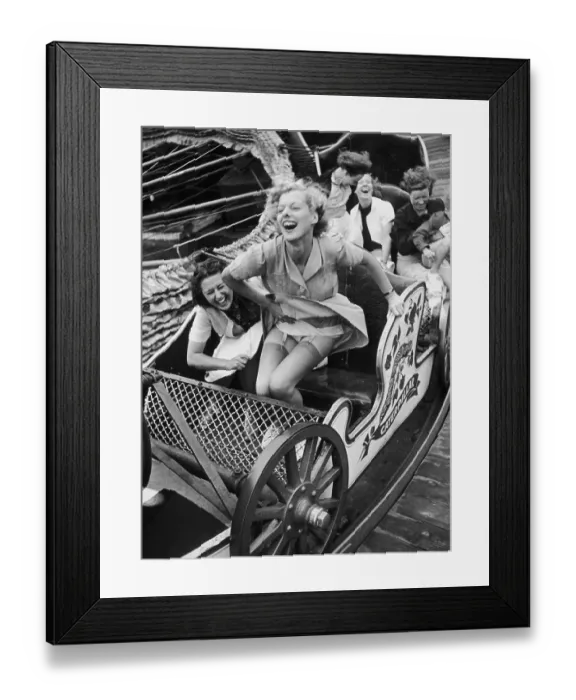 Framed Print : Fair Fun. Two young women enjoying themselves on the Caterpillar ride at Southend Fair