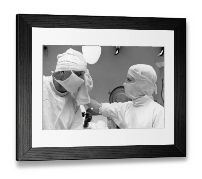Framed Print : Wiping Surgeon