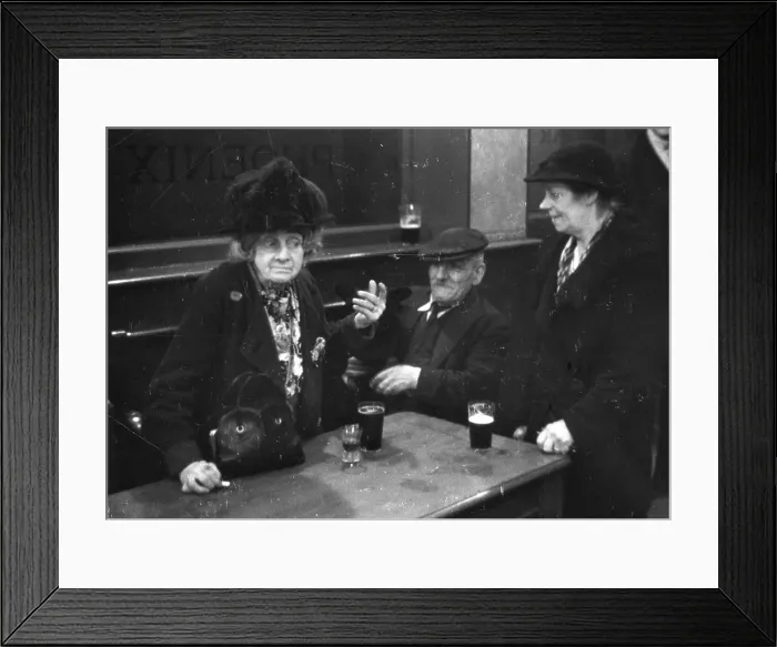 Framed Print : Pubs. Elderly people having a drink in a public house