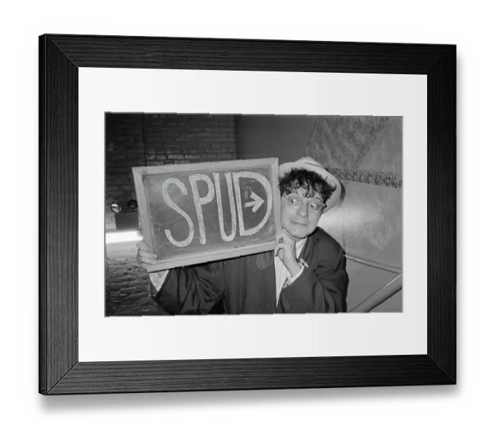 Framed Print : Spud. A man holding a handwritten sign saying Spud Framed Print : Spud. A man holding a handwritten sign saying Spud