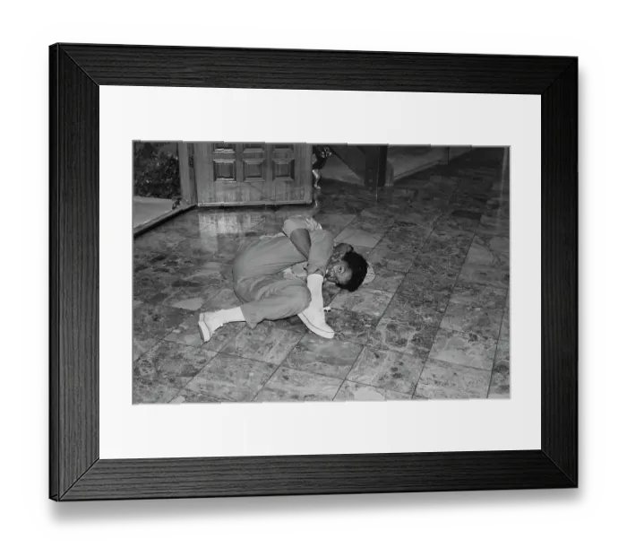 Framed Print : Breakin. A breakdancer reclining on a marble-effect tiled floor, United States, circa 1985 Framed Print : Breakin. A breakdancer reclining on a marble-effect tiled floor, United States, circa 1985