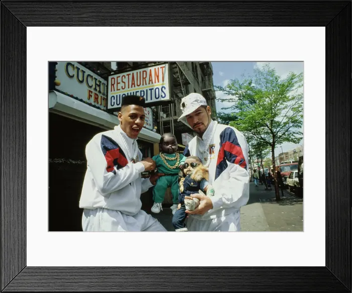 Framed Print : Latin Empire Holding A Baby Doll