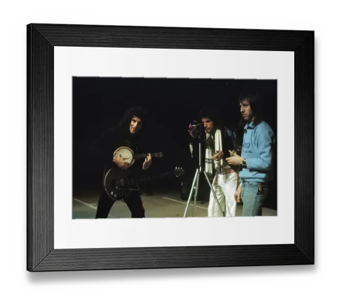 Framed Print : Queen. Musician Brian May of British rock band Queen plays banjolele while Framed Print : Queen. Musician Brian May of British rock band Queen plays banjolele while