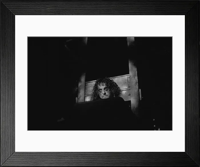 Framed Print : Alice Cooper with his head in a guillotine Framed Print : Alice Cooper with his head in a guillotine