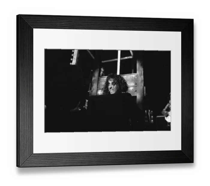 Framed Print : Alice Cooper with his head in a guillotine Framed Print : Alice Cooper with his head in a guillotine