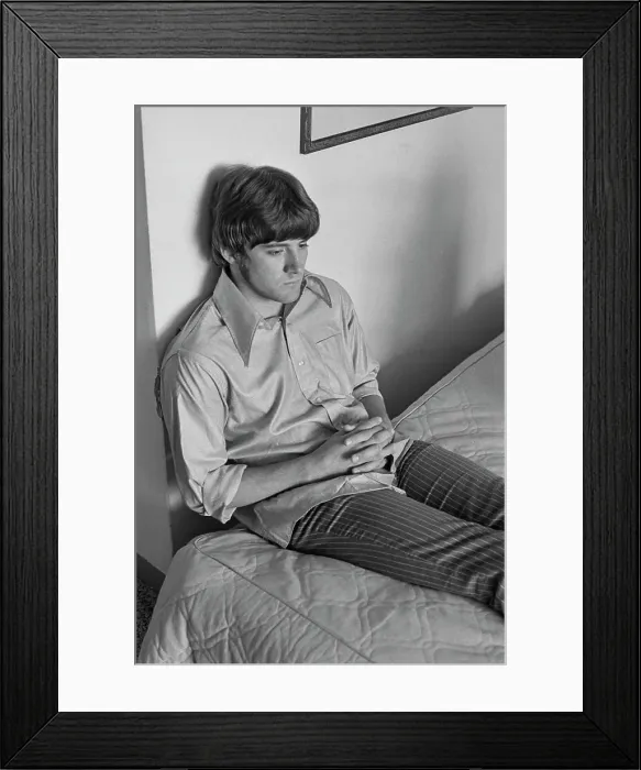 Framed Print : Guitarist. A musician sitting on a bed, USA, circa 1968 Framed Print : Guitarist. A musician sitting on a bed, USA, circa 1968