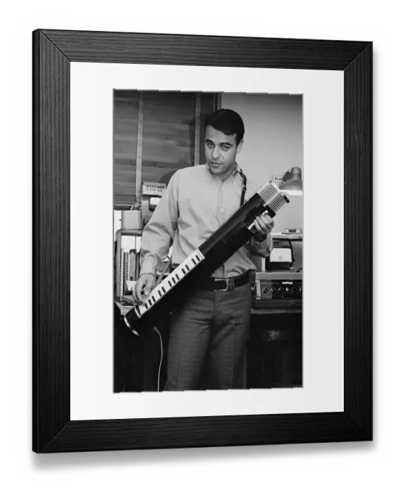 Framed Print : Tubon. An unspecified musician wearing a shirt that is open at the collar Framed Print : Tubon. An unspecified musician wearing a shirt that is open at the collar