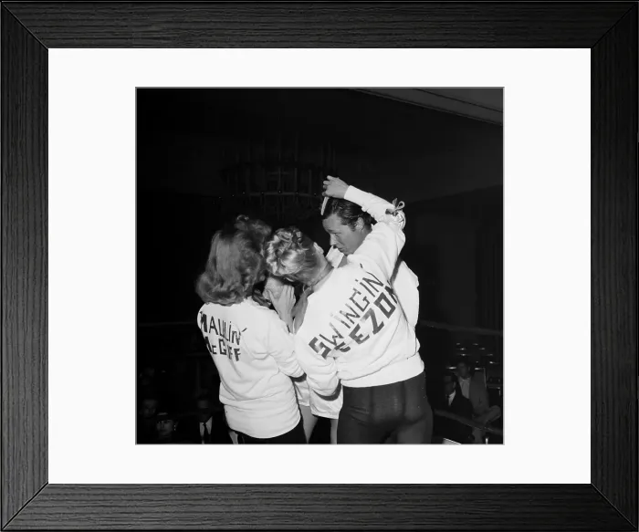 Framed Print : Boxing. LOS ANGELES, CA - CIRCA 1957: A view of two women help support Framed Print : Boxing. LOS ANGELES, CA - CIRCA 1957: A view of two women help support