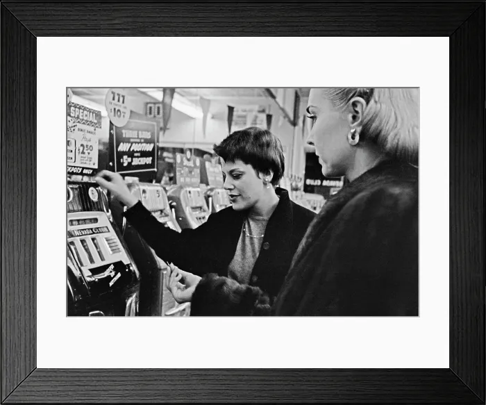 Framed Print : Gamblers Hit The Slots In Las Vegas