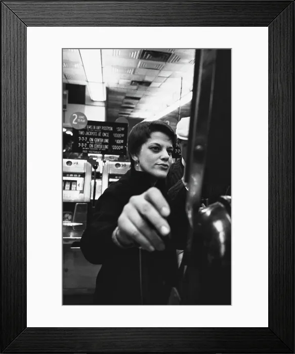 Framed Print : Gamblers Hit The Slots In Las Vegas