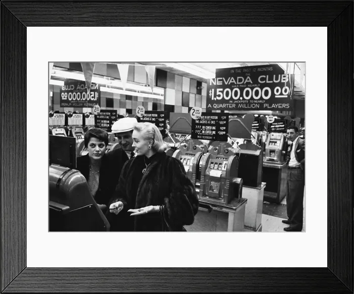 Framed Print : Gamblers Hit The Slots In Las Vegas