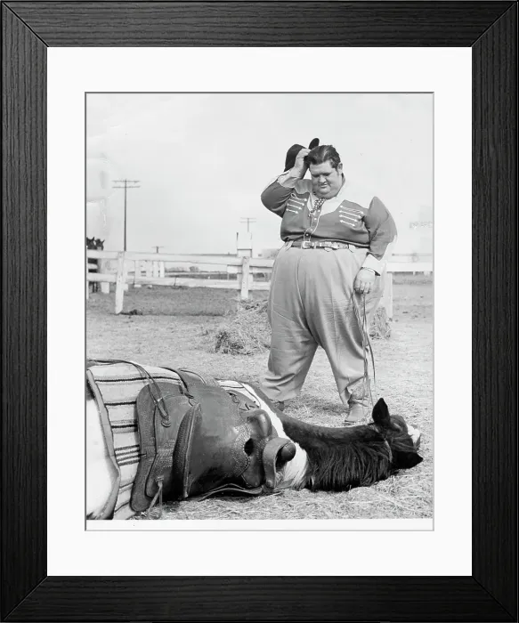 Framed Print : Fat Man Stands Over Fallen Horse