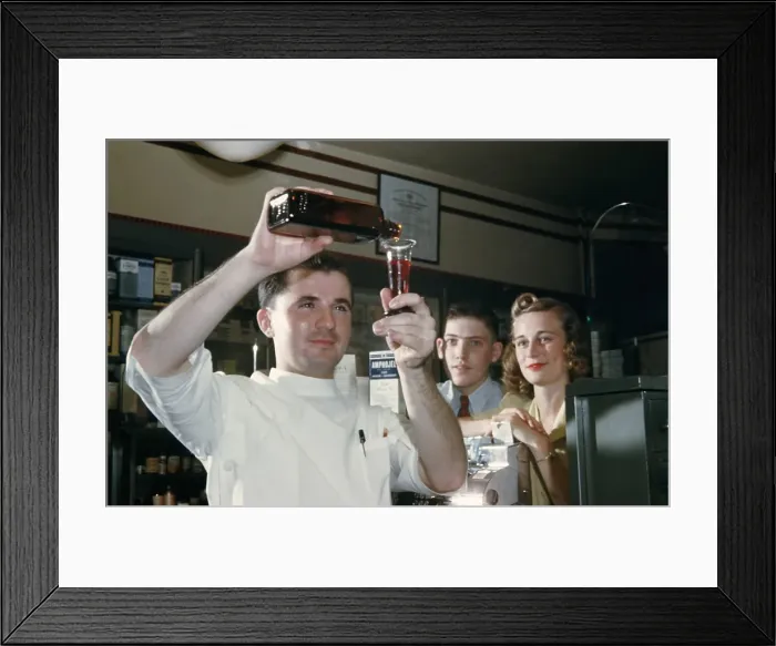 Framed Print : Pharmacy. NEW YORK - SEPTEMBER 1941: A Pharmacist prepares a prescription Framed Print : Pharmacy. NEW YORK - SEPTEMBER 1941: A Pharmacist prepares a prescription