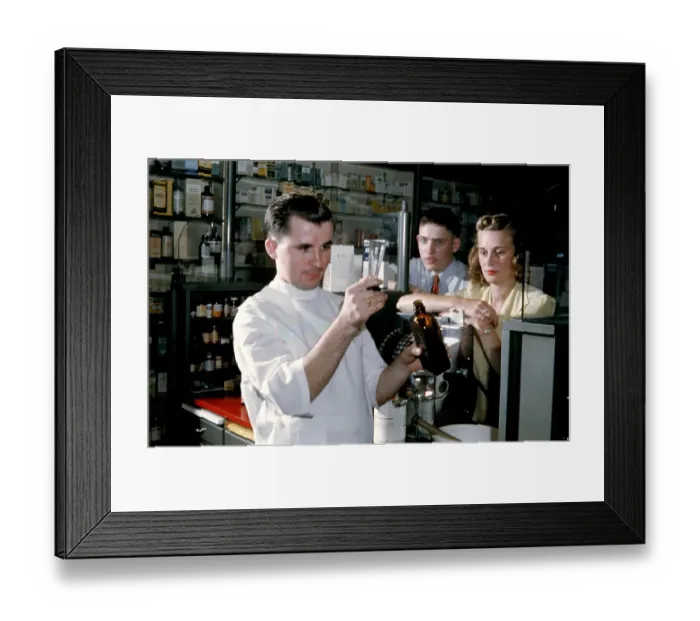 Framed Print : Pharmacy. NEW YORK - SEPTEMBER 1941: A Pharmacist prepares a prescription Framed Print : Pharmacy. NEW YORK - SEPTEMBER 1941: A Pharmacist prepares a prescription