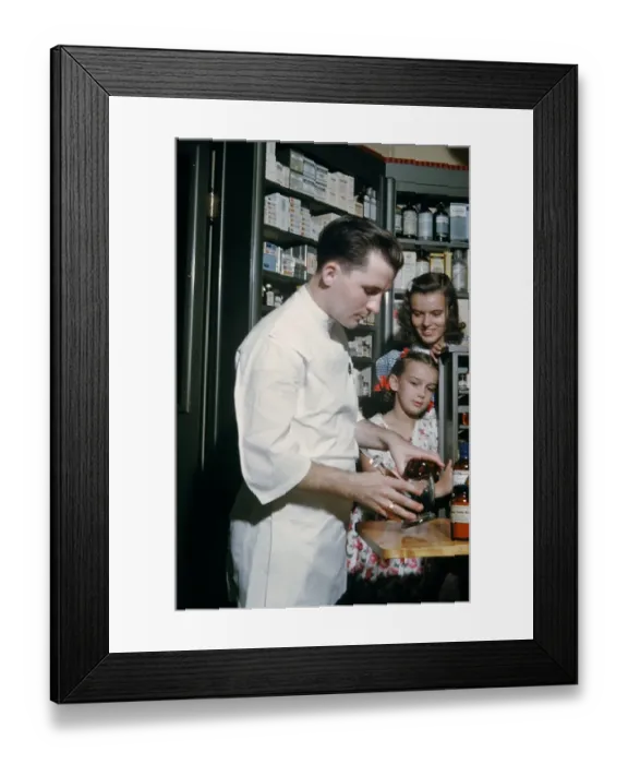 Framed Print : Pharmacy. NEW YORK - SEPTEMBER 1941: A Pharmacist prepares a prescription Framed Print : Pharmacy. NEW YORK - SEPTEMBER 1941: A Pharmacist prepares a prescription