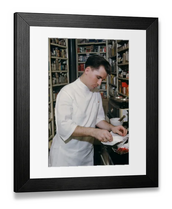 Framed Print : Pharmacy. NEW YORK - SEPTEMBER 1941: A Pharmacist prepares a prescription Framed Print : Pharmacy. NEW YORK - SEPTEMBER 1941: A Pharmacist prepares a prescription