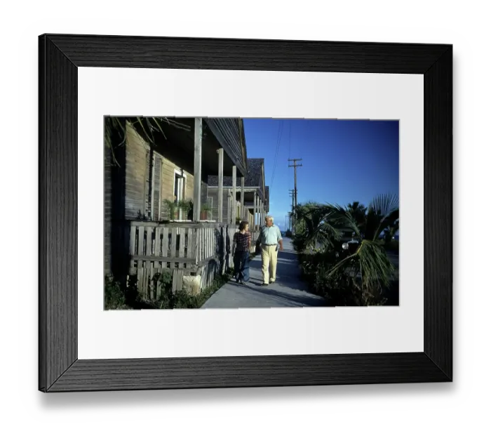 Framed Print : KEY WEST, FL - CIRCA 1946: A couple walks down a path in Key West, Florida Framed Print : KEY WEST, FL - CIRCA 1946: A couple walks down a path in Key West, Florida