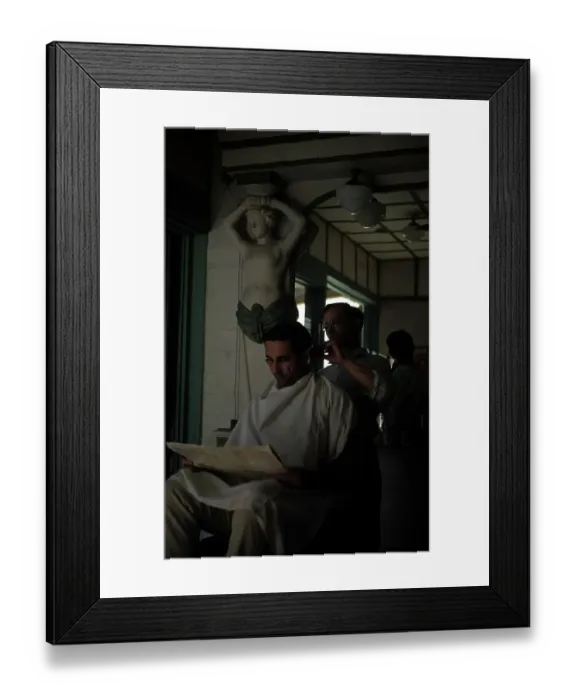 Framed Print : KEY WEST, FL - CIRCA 1946: A man gets a hair cut in Key West, Florida Framed Print : KEY WEST, FL - CIRCA 1946: A man gets a hair cut in Key West, Florida