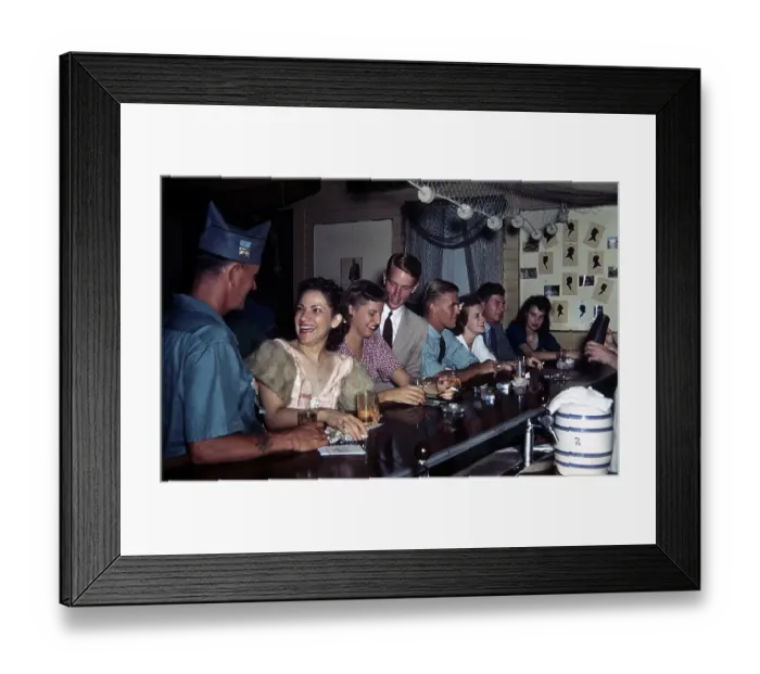 Framed Print : KEY WEST, FL - CIRCA 1946: A view as young people sit at a bar for a drink in Key West Framed Print : KEY WEST, FL - CIRCA 1946: A view as young people sit at a bar for a drink in Key West