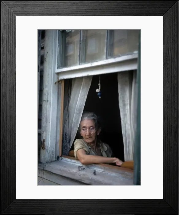 Framed Print : KEY WEST, FL - CIRCA 1946: A view as an old women looks out her window in Key West Framed Print : KEY WEST, FL - CIRCA 1946: A view as an old women looks out her window in Key West