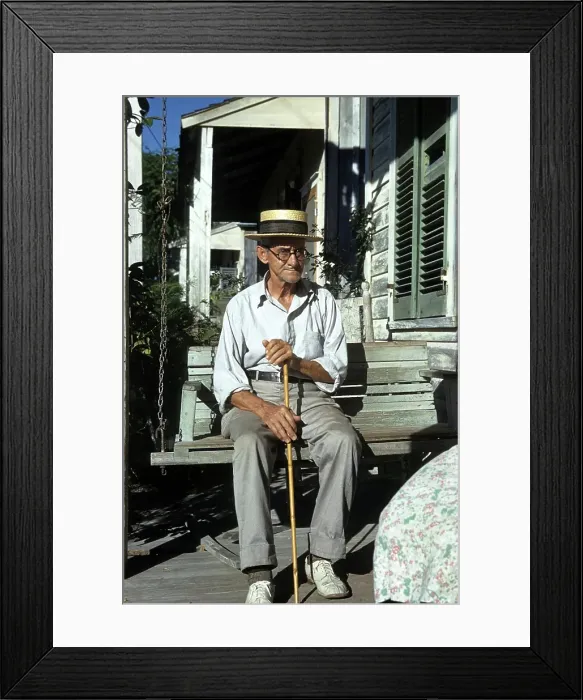 Framed Print : KEY WEST, FL - CIRCA 1946: A view as a old man sits with his cane in Key West, Florida Framed Print : KEY WEST, FL - CIRCA 1946: A view as a old man sits with his cane in Key West, Florida