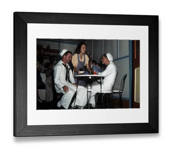 Framed Print : KEY WEST, FL - CIRCA 1946: A view as two navy sailors get a drink in Key West, Florida Framed Print : KEY WEST, FL - CIRCA 1946: A view as two navy sailors get a drink in Key West, Florida