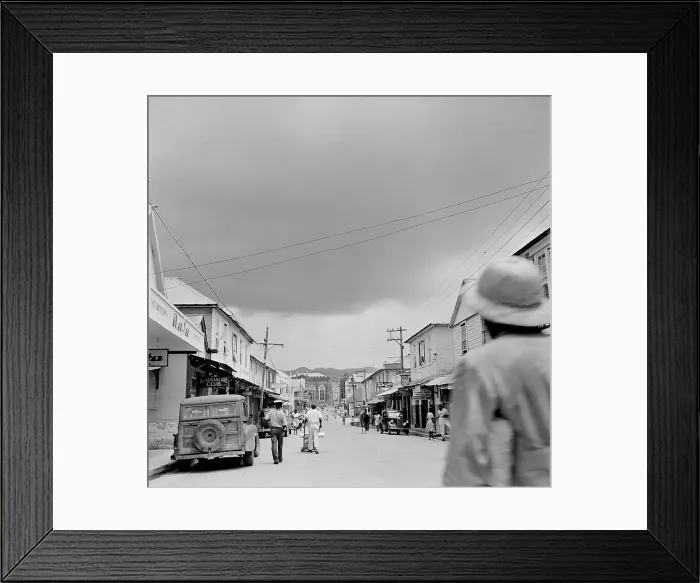 Framed Print : Jamaica. JAMAICA - FEBRUARY 1946: A view down a busy local street in Jamaica. Framed Print : Jamaica. JAMAICA - FEBRUARY 1946: A view down a busy local street in Jamaica.