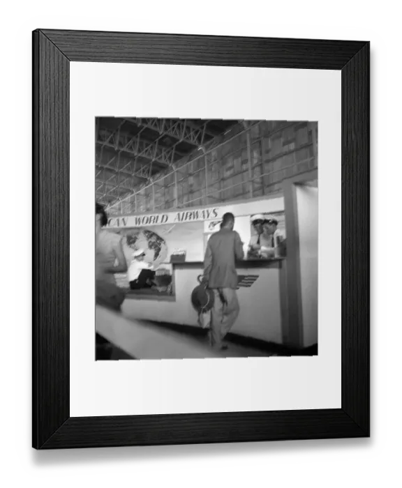 Framed Print : Pan Am. SAN JUAN, PUERTO RICO - CIRCA 1947: A passenger buys a ticket at Framed Print : Pan Am. SAN JUAN, PUERTO RICO - CIRCA 1947: A passenger buys a ticket at