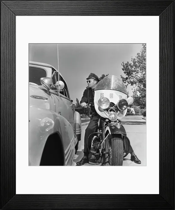 Framed Print : Cycle Cop. A motorcycle policeman talking to a man Framed Print : Cycle Cop. A motorcycle policeman talking to a man