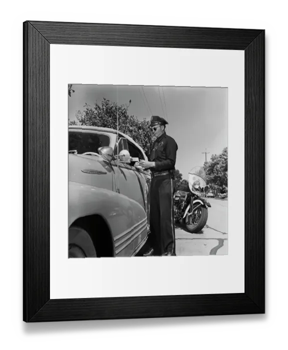 Framed Print : Cycle Cop. A motorcycle policeman checking the driving licence of a man Framed Print : Cycle Cop. A motorcycle policeman checking the driving licence of a man