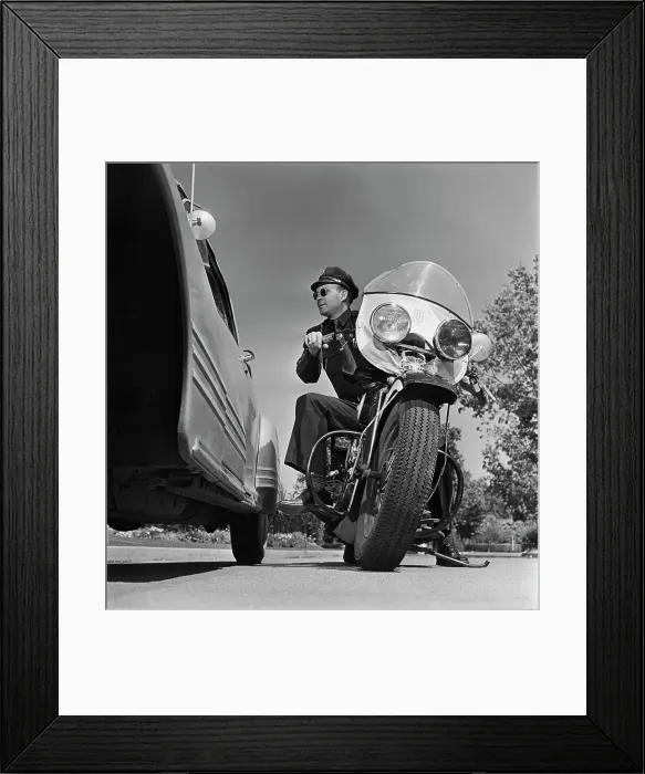 Framed Print : Cycle Cop. A motorcycle policeman talking to a man Framed Print : Cycle Cop. A motorcycle policeman talking to a man