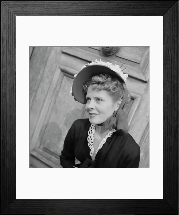 Framed Print : Très Chic. A female model wearing a black outfit with white trim Framed Print : Très Chic. A female model wearing a black outfit with white trim