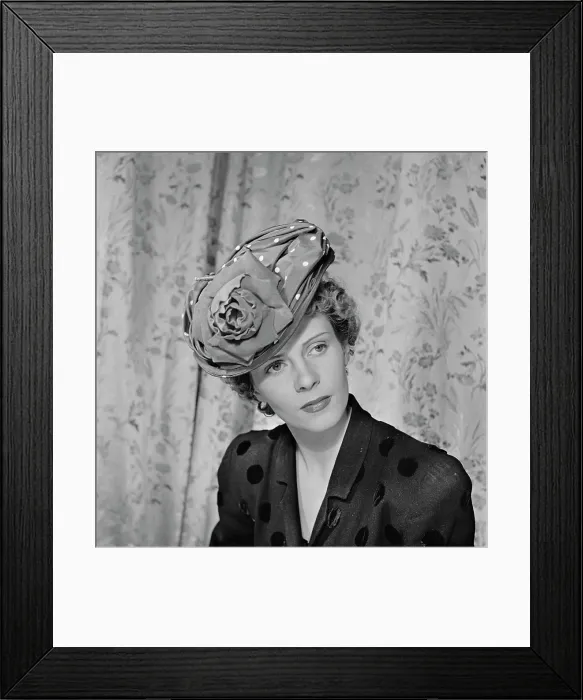 Framed Print : Très Chic. A female model wearing a black v-neck outfit Framed Print : Très Chic. A female model wearing a black v-neck outfit