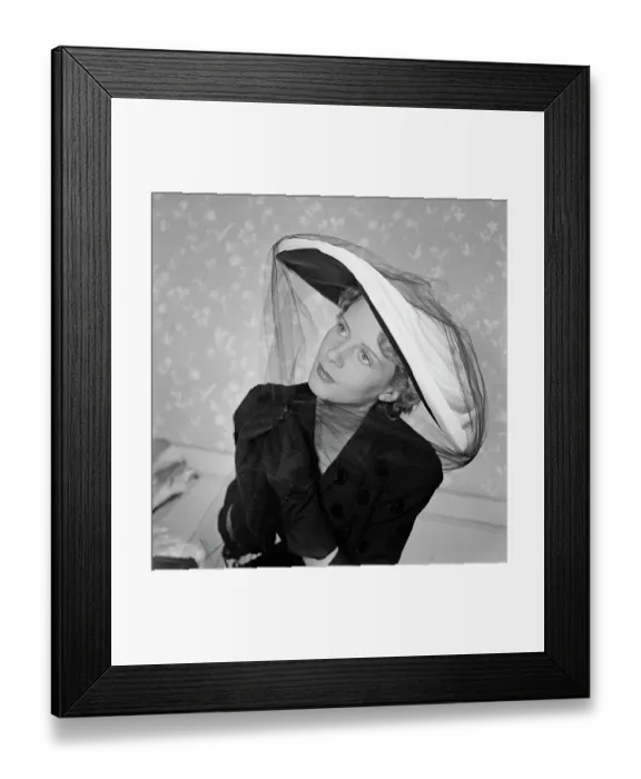 Framed Print : Très Chic. A female model wearing a dark polka-dot v-neck outfit with dark gloves Framed Print : Très Chic. A female model wearing a dark polka-dot v-neck outfit with dark gloves