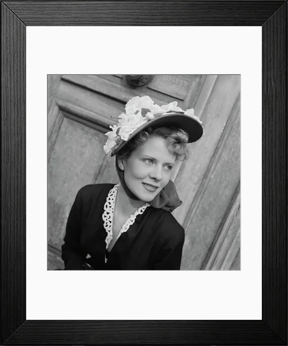 Framed Print : Très Chic. A female model wearing a black outfit with white trim Framed Print : Très Chic. A female model wearing a black outfit with white trim