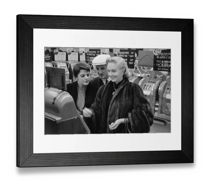 Framed Print : Playing the slot machines in the Flamingo Hotel casino