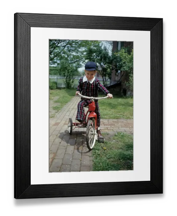 Framed Print : Boy Rides A Red Tricycle Framed Print : Boy Rides A Red Tricycle