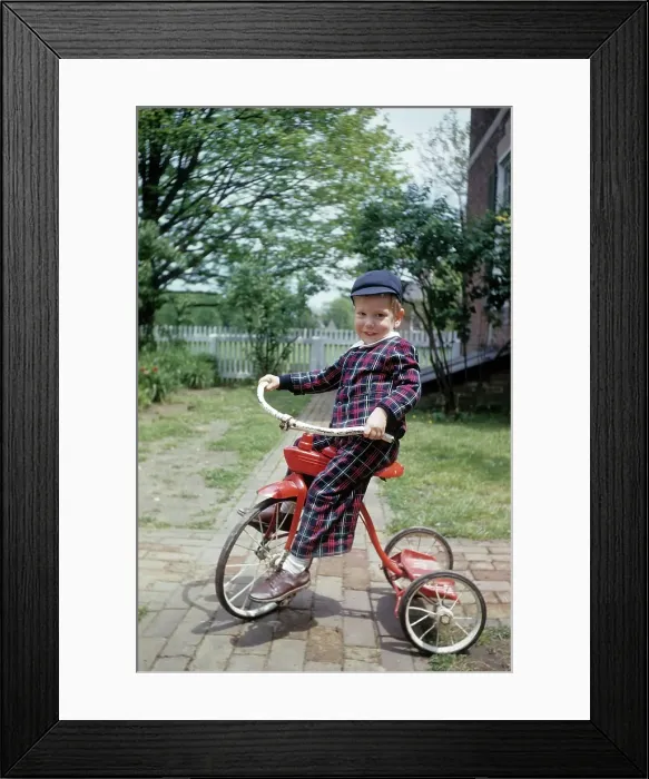 Framed Print : Boy Rides A Red Tricycle Framed Print : Boy Rides A Red Tricycle