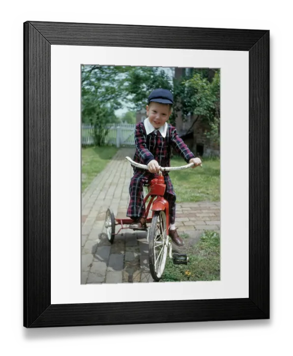 Framed Print : Boy Rides A Red Tricycle Framed Print : Boy Rides A Red Tricycle