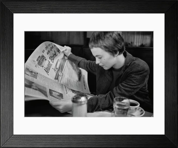 Framed Print : Jean Seberg Reading Newspaper Framed Print : Jean Seberg Reading Newspaper