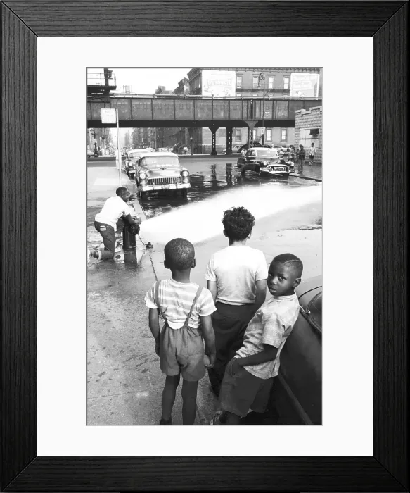 Framed Print : Harlem. NEW YORK - JUNE 1957: A group of kids wait to play in the water Framed Print : Harlem. NEW YORK - JUNE 1957: A group of kids wait to play in the water