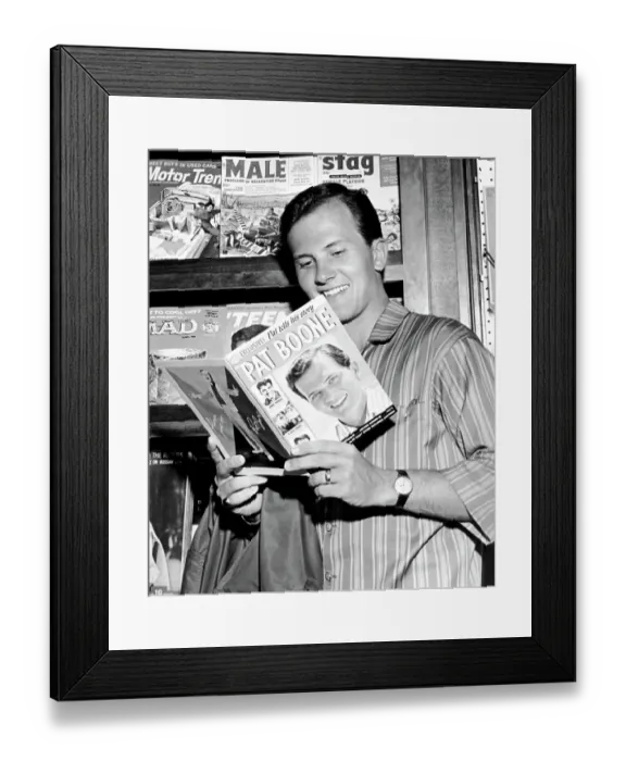 Framed Print : Pat Boone. Singer Pat Boone reads a fan magazine about himself in 1959 in Los Angeles Framed Print : Pat Boone. Singer Pat Boone reads a fan magazine about himself in 1959 in Los Angeles
