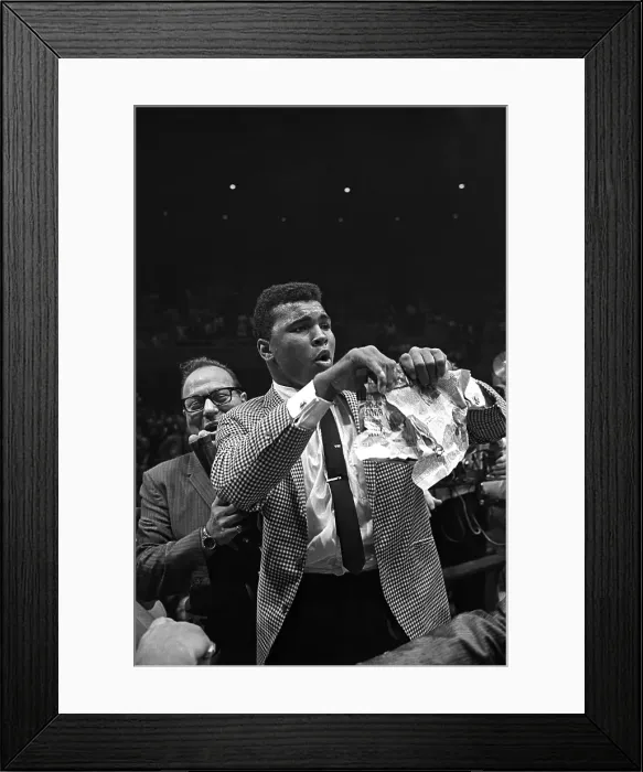 Framed Print : LAS VEGAS, NV - JULY 22: Heavyweight contender Cassius Clay (later known as Muhammad Ali) attempts to get to the ring to taunt Sonny Liston who has just defeated former champion Floyd Patterson to retain his heavyweight crown) on July 22 Framed Print : LAS VEGAS, NV - JULY 22: Heavyweight contender Cassius Clay (later known as Muhammad Ali) attempts to get to the ring to taunt Sonny Liston who has just defeated former champion Floyd Patterson to retain his heavyweight crown) on July 22