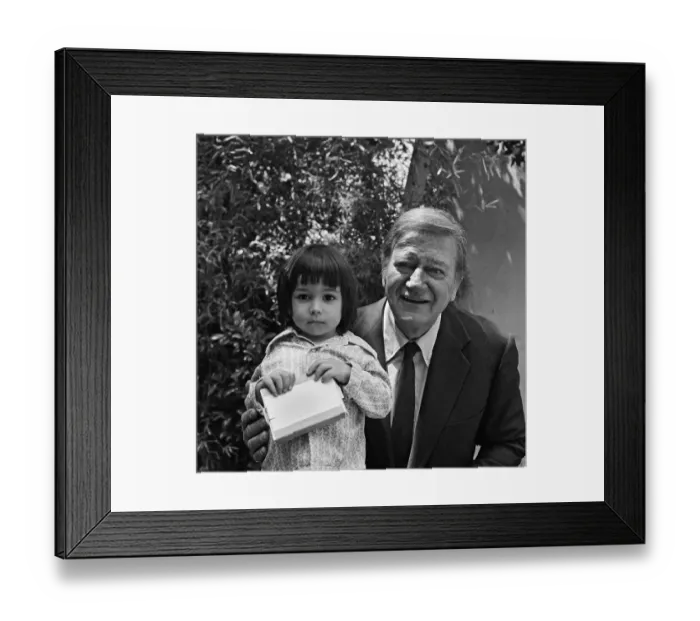 Framed Print : John Wayne Poses With A Little Girl Framed Print : John Wayne Poses With A Little Girl