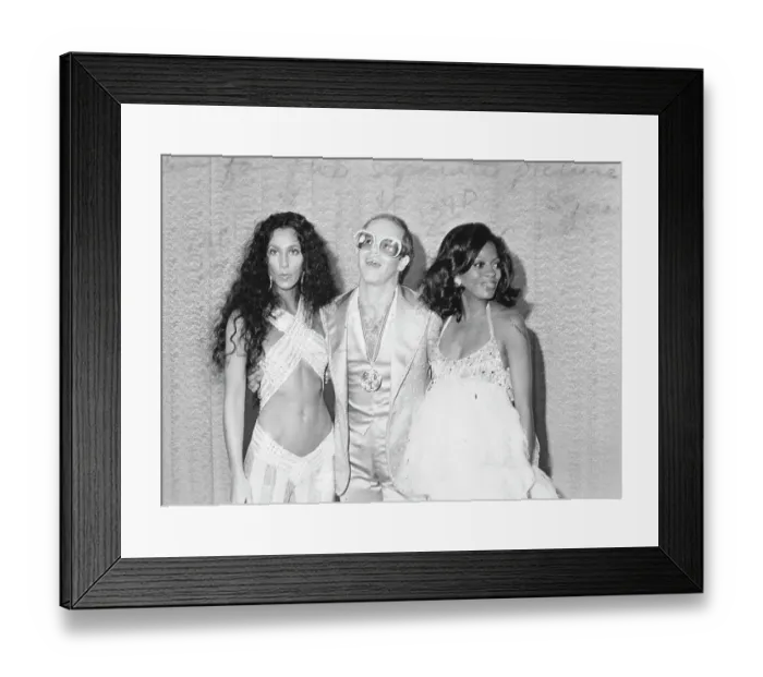 Framed Print : Divas. CIRCA 1975: Pop singers Cher, Elton John Framed Print : Divas. CIRCA 1975: Pop singers Cher, Elton John
