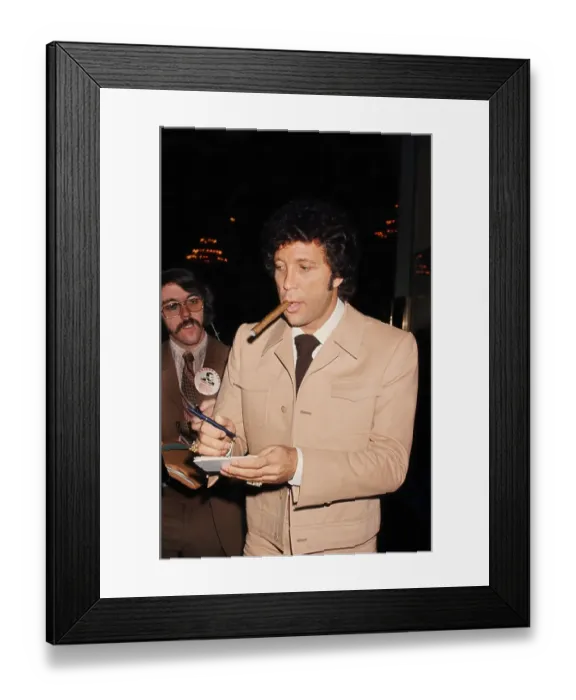 Framed Print : Tom Jones. LOS ANGELES - FEBRUARY 6: Welsh singer Tom Jones smokes a cigar Framed Print : Tom Jones. LOS ANGELES - FEBRUARY 6: Welsh singer Tom Jones smokes a cigar