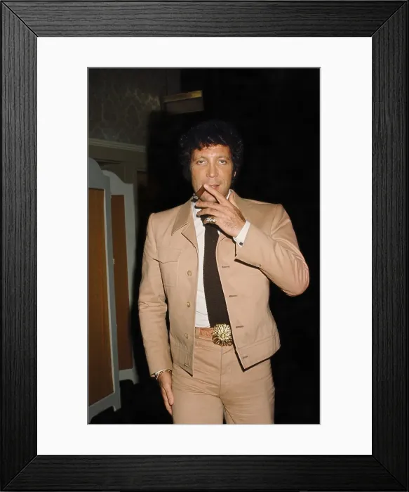 Framed Print : Tom Jones. LOS ANGELES - FEBRUARY 6: Welsh singer Tom Jones smokes a cigar Framed Print : Tom Jones. LOS ANGELES - FEBRUARY 6: Welsh singer Tom Jones smokes a cigar
