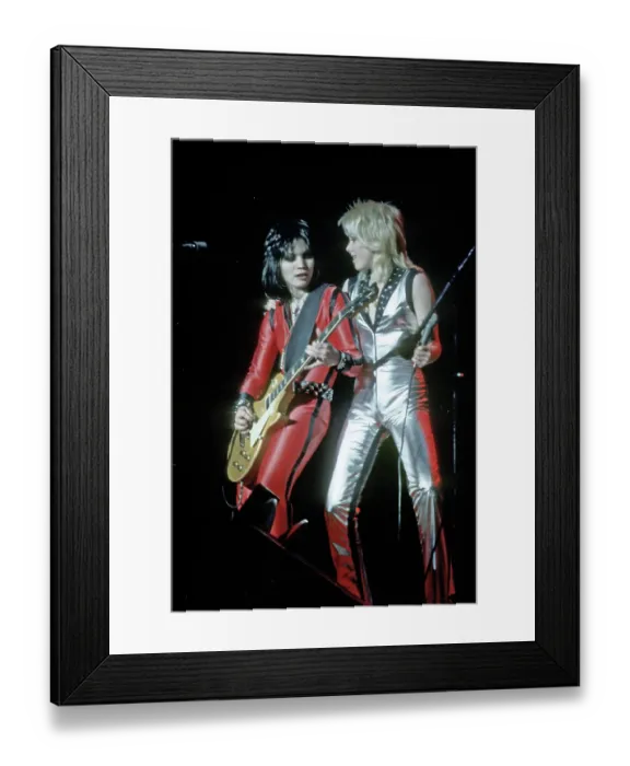 Framed Print : Guitarist Joan Jett & Singer Cherie Currie of the rock band The Runaways Framed Print : Guitarist Joan Jett & Singer Cherie Currie of the rock band The Runaways