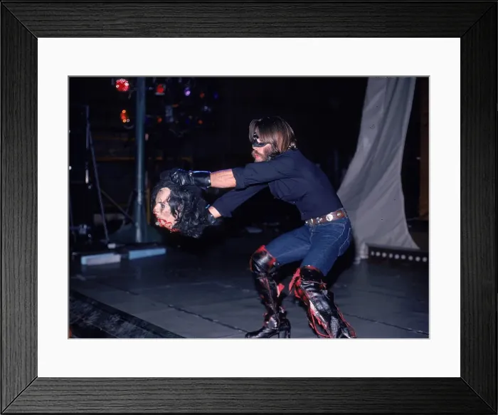 Framed Print : Alice Cooper's decapitated head in the hands of an executioner Framed Print : Alice Cooper's decapitated head in the hands of an executioner